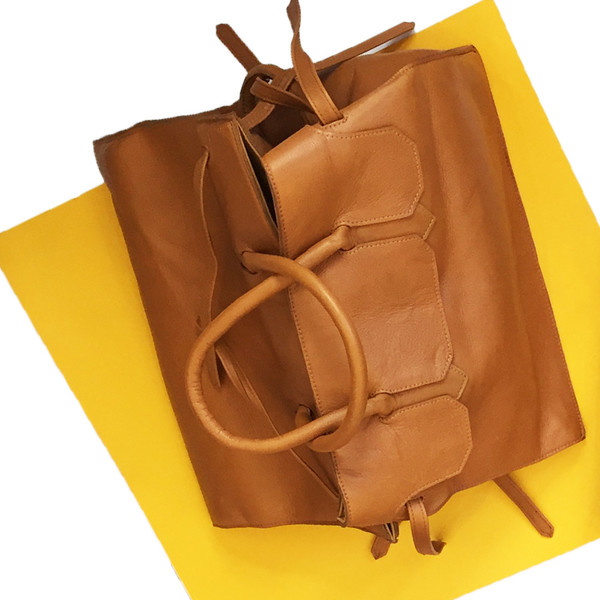 Slow and Steady Wins the Race Four Sided Rectangular Bag in Camel Slow and Steady Wins the Race Four Sided Rectangular Bag in Camel