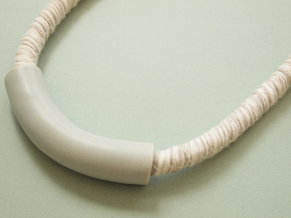 YYY short tube necklace on variegated cord YYY short tube necklace on variegated cord