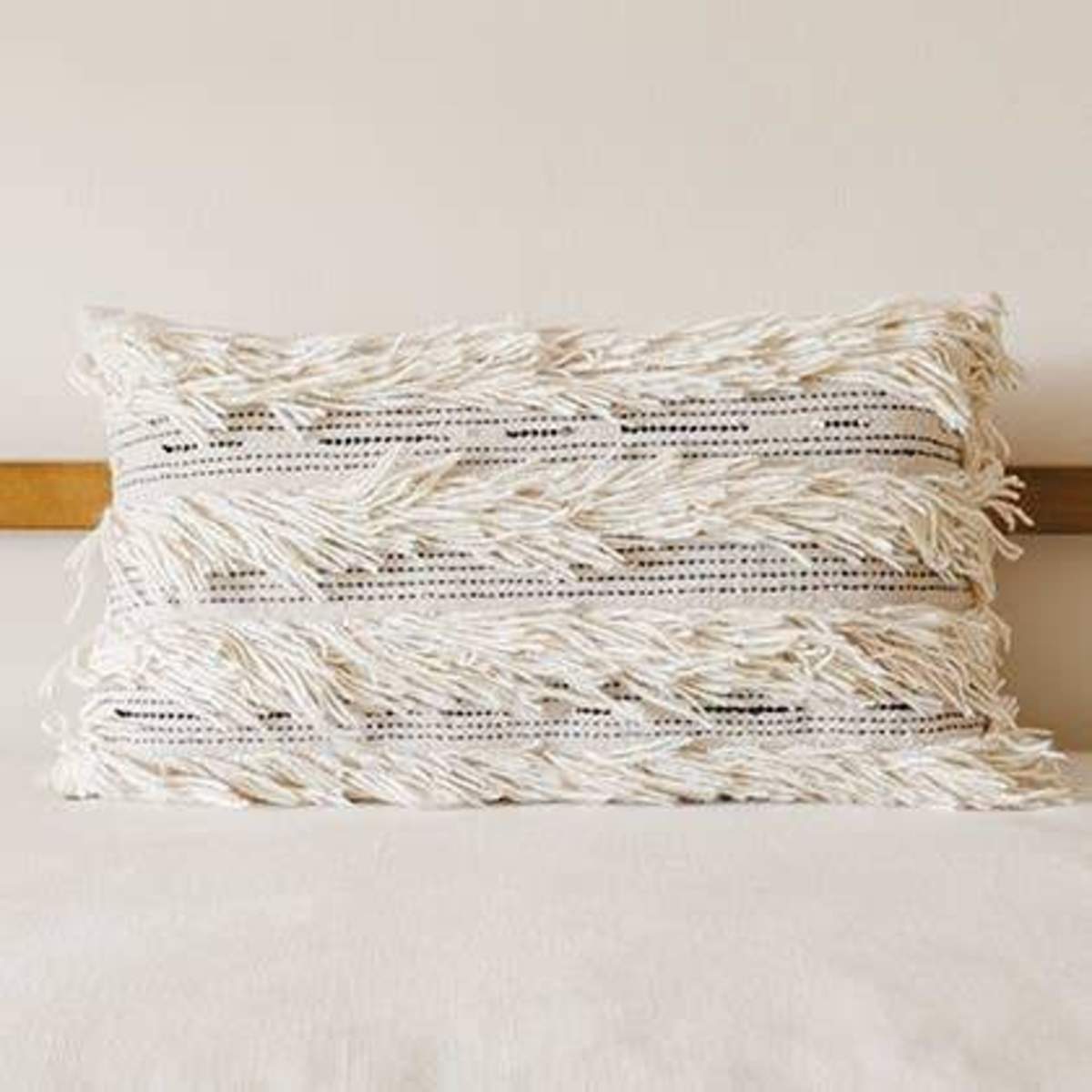 white fringe throw pillow